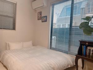 CuteFamilyHouse! 6minShinjuku 6minSta FreeParking Cozy,Bright KidsFree Under6yrs客房内的一张或多张床位