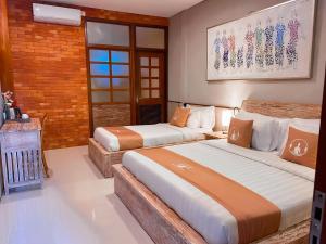 Postel nebo postele na pokoji v ubytování Alam Kawi Ubud Resort & Spa