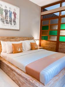 Postel nebo postele na pokoji v ubytování Alam Kawi Ubud Resort & Spa