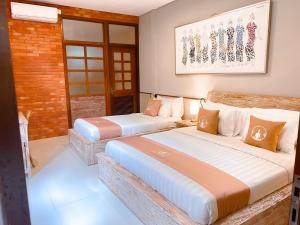 Postel nebo postele na pokoji v ubytování Alam Kawi Ubud Resort & Spa