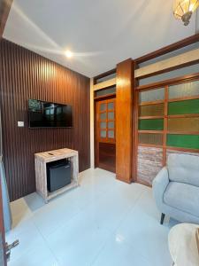 TV a/nebo společenská místnost v ubytování Alam Kawi Ubud Resort & Spa + 37 fotografií