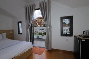 Postel nebo postele na pokoji v ubytování Hotel Pansy