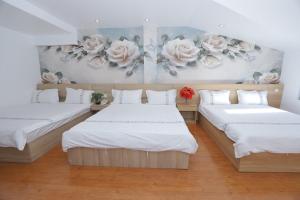 Postel nebo postele na pokoji v ubytování Hotel Pansy