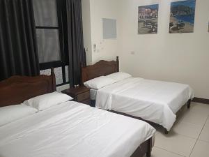 Una cama o camas en una habitación de Yan Gui Lai B&B