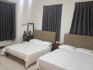 Una cama o camas en una habitación de Yan Gui Lai B&B