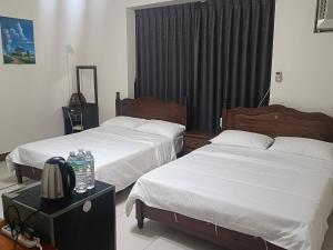 Una cama o camas en una habitación de Yan Gui Lai B&B