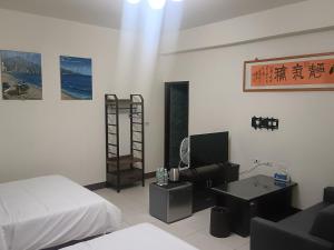 Una cama o camas en una habitación de Yan Gui Lai B&B