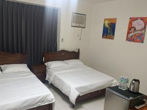 Una cama o camas en una habitación de Yan Gui Lai B&B