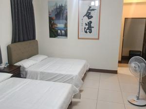 Una cama o camas en una habitación de Yan Gui Lai B&B