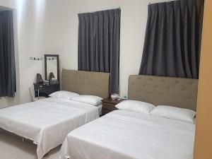 Una cama o camas en una habitación de Yan Gui Lai B&B