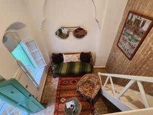 an overhead view of a room with a couch and a window at Dar Adul in Essaouira