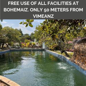 a river in a park with text overlay free use of all facilities at bothell at Vimeanz @Bohemiaz in Kampot
