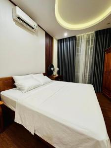 Postel nebo postele na pokoji v ubytování Tuan Anh Hostel