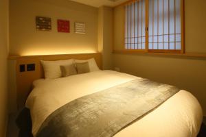 KYOTO GION HOTEL客房内的一张或多张床位
