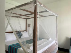 Katil atau katil-katil dalam bilik di Nico Beach Hotel