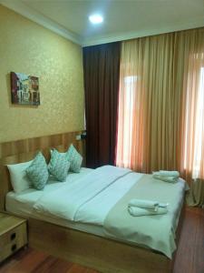 Postel nebo postele na pokoji v ubytování Epic Meidan Hotel