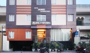 a building with two motorcycles parked in front of it at Hotel Janki International Sigra 2 KM From Kashi Vishwanath Temple in Varanasi