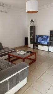 a living room with a couch and a coffee table at Villa à Lomé in Lomé