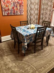 a dining room table with a blue and white table cloth at St Louis House near Arch and Ballpark Village in Soulard