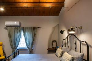 Llit o llits en una habitació de La casetta di Francy, Medea