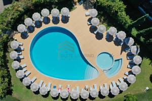 an overhead view of a water park with a swimming pool at Suites Marilia Apartments - Suite Livorno Holiday Home Group in Livorno