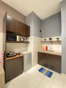 a small kitchen with a sink and a counter at 5mins to Sunway #Subang SS15 Stylish Studio #3pax in Subang Jaya