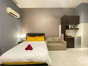 a bedroom with a large bed and a chair at 5mins to Sunway #Subang SS15 Stylish Studio #3pax in Subang Jaya