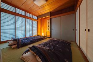 En eller flere senge i et værelse på おやど紀伊国屋中町