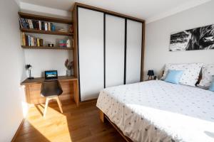 Postel nebo postele na pokoji v ubytování Rodinný apartmán v srdci Krkonoš
