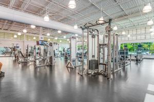 a gym with a lot of machines in it at Sea Colony - 902 Georgetowne House in Bethany Beach