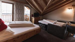 מיטה או מיטות בחדר ב-Pension Truya - Hof