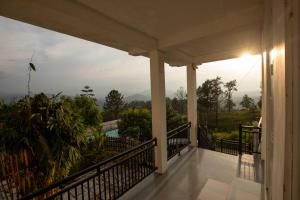 a balcony of a house with a view at Ama Residency & Homestay Kandy in Hindagala
