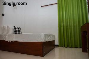 Postel nebo postele na pokoji v ubytování Randon Resort Mirissa