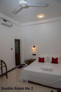 Postel nebo postele na pokoji v ubytování Randon Resort Mirissa