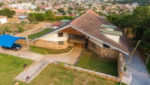 an aerial view of a house with a roof at Inviting 3-Bed House in Awoshie Accra in Kwashieman
