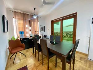 a dining room with a table and chairs at Inviting 3-Bed House in Awoshie Accra in Kwashieman