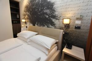 Postel nebo postele na pokoji v ubytování Hotel Villa Rosa