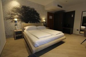 Postel nebo postele na pokoji v ubytování Hotel Villa Rosa