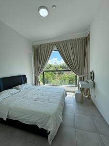 a bedroom with a bed and a large window at Sandakan Blue Coastal escape 蓝海岩栖 in Sandakan