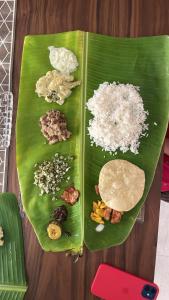 two plates of food on a green banana leaf at ANGELSNESTMOUNTAINVIEW in Chegāt