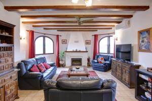 a living room with couches and a fireplace at Casa Miranda in Orba