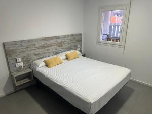 Posteľ alebo postele v izbe v ubytovaní Agi Solimar Atico