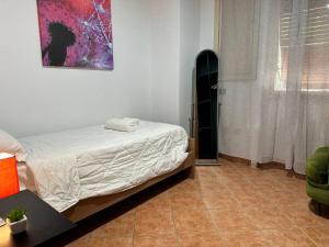 a bedroom with a bed in a room with a window at COSENZA Galluppi 23 in Cosenza