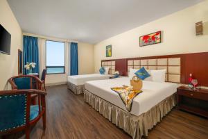 Postelja oz. postelje v sobi nastanitve SeaFront Hotel DaNang + 37 fotografij