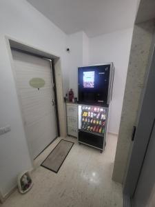 a small refrigerator with a television in a room at Santa Maria Vetere in Andria