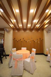 a conference room with a table and chairs at Hotel Wedlock 51 in Gurgaon