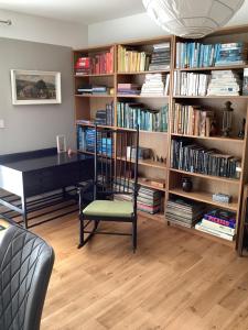 a room with a desk and a chair and book shelves at Springwood - Royal Hillsborough in Hillsborough