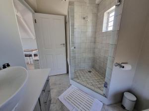 a bathroom with a shower and a sink at Manatoka Unit 3 in Jacobs Bay