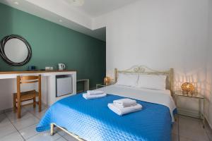 A bed or beds in a room at V-rooms in Milos Cyclades