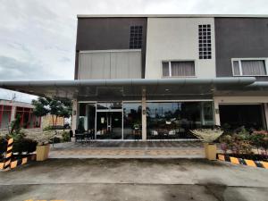 a large building with a large glass front at Altori Park Hotel in General Santos